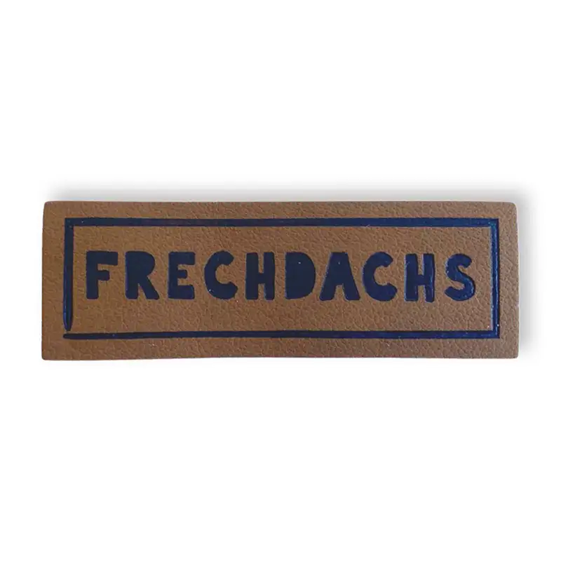 Lederlabel mit Aufschrift Frechdachs